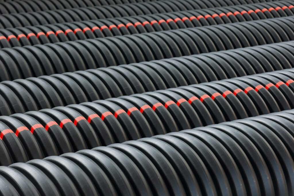 bunches of pvc pipe sitting on palets at a wholesale pipe store 1 Coastal Resources Group