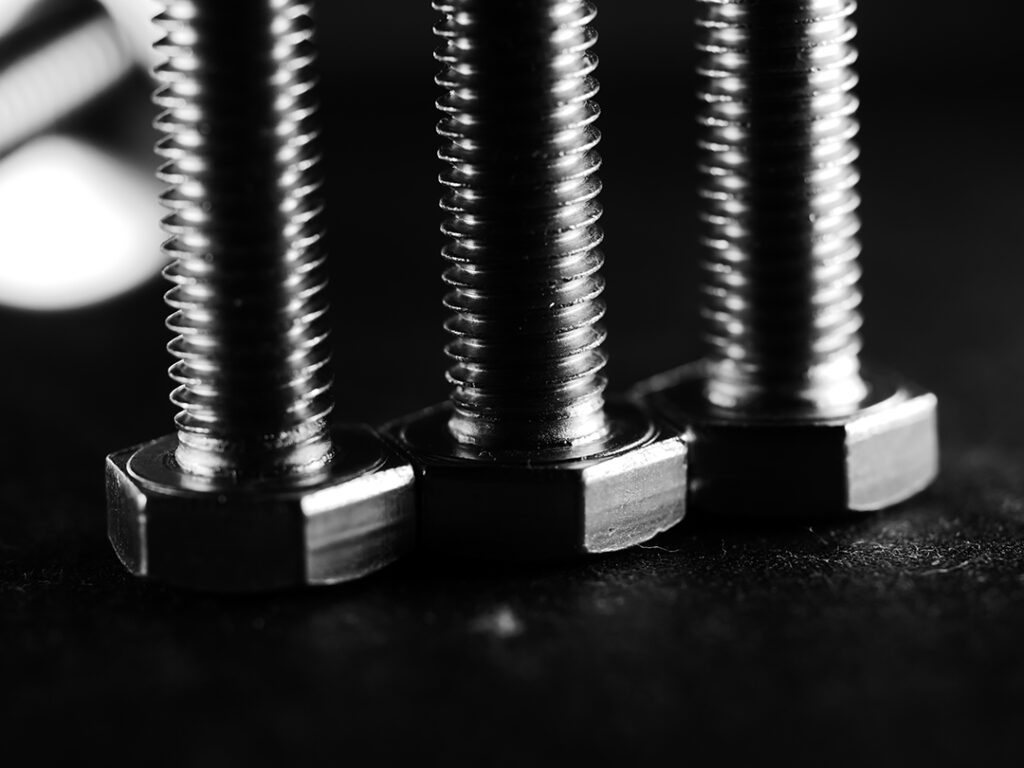 closeu shot of metal screw threads isolated on the black background Coastal Resources Group