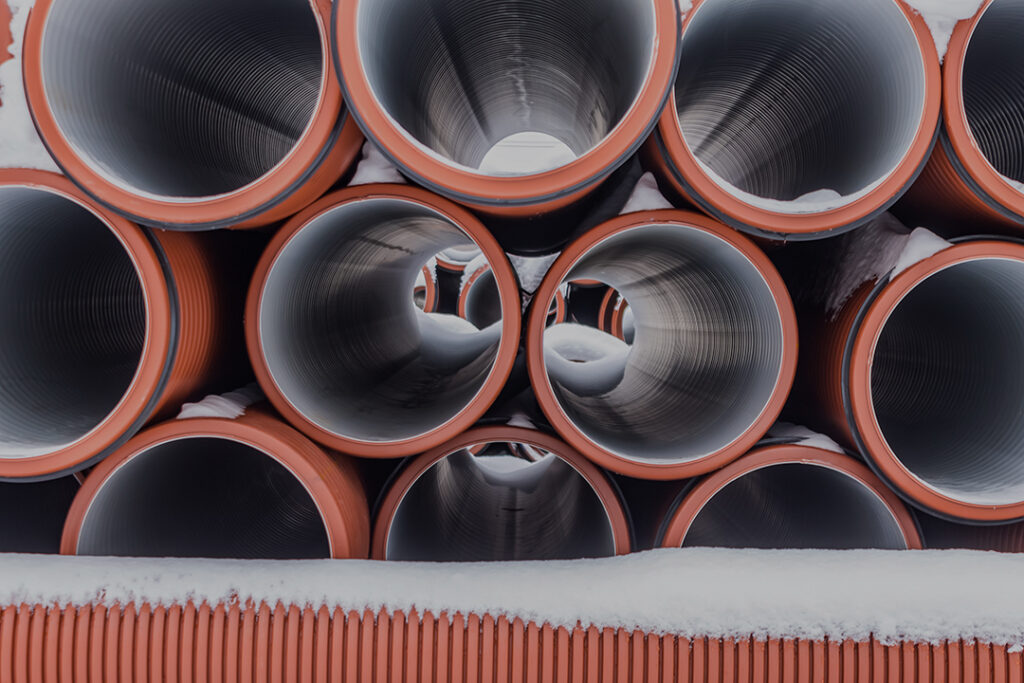 large sectional sewer pipes covered with snow Coastal Resources Group