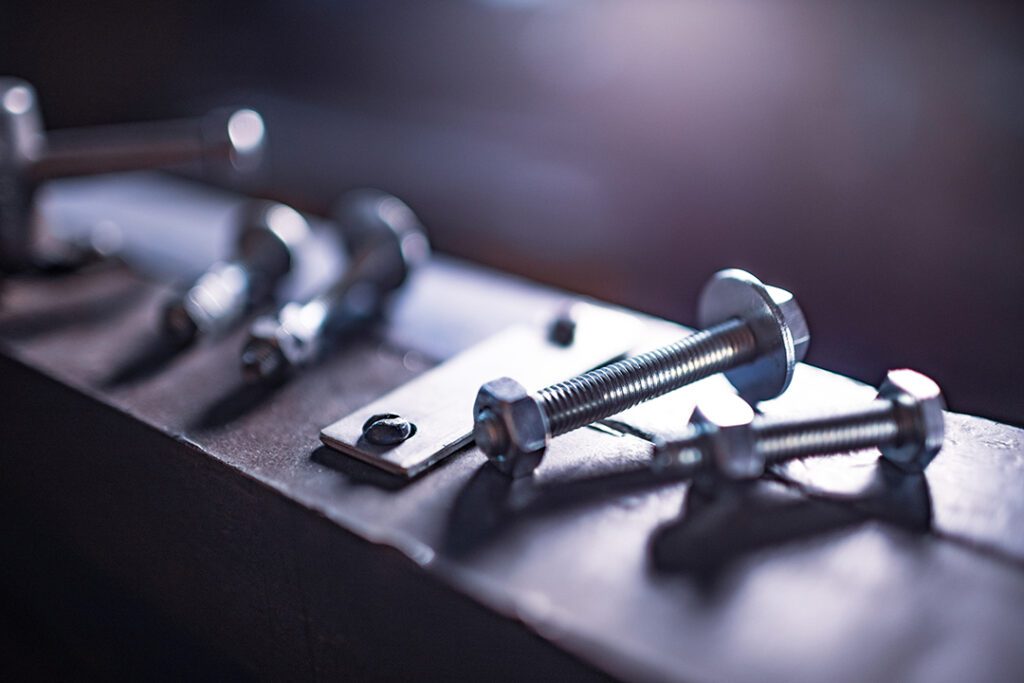 metal chrome bolts and nuts on manual flexible massive machine Coastal Resources Group