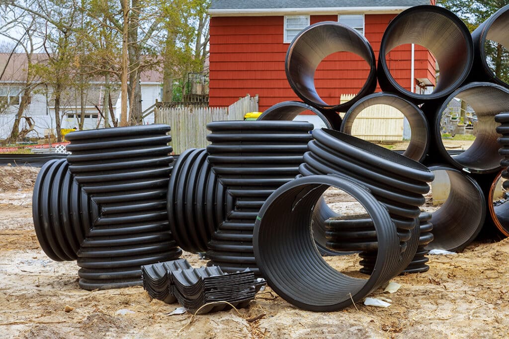 plastic pvc pipes stacked in rows at a constructio 2 Coastal Resources Group