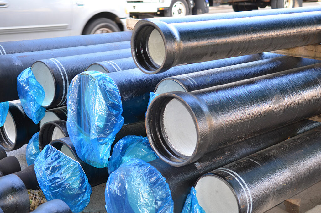 sewer pipes are stacked on working zone Coastal Resources Group
