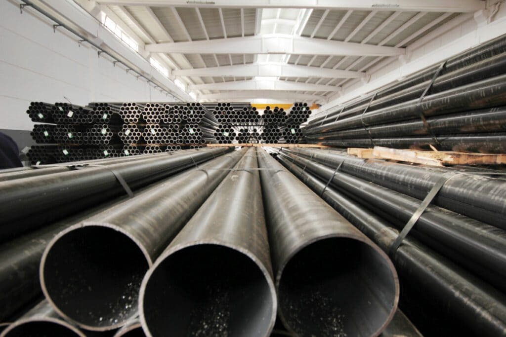 Industrial pipelines and modern equipment in cheese production interior