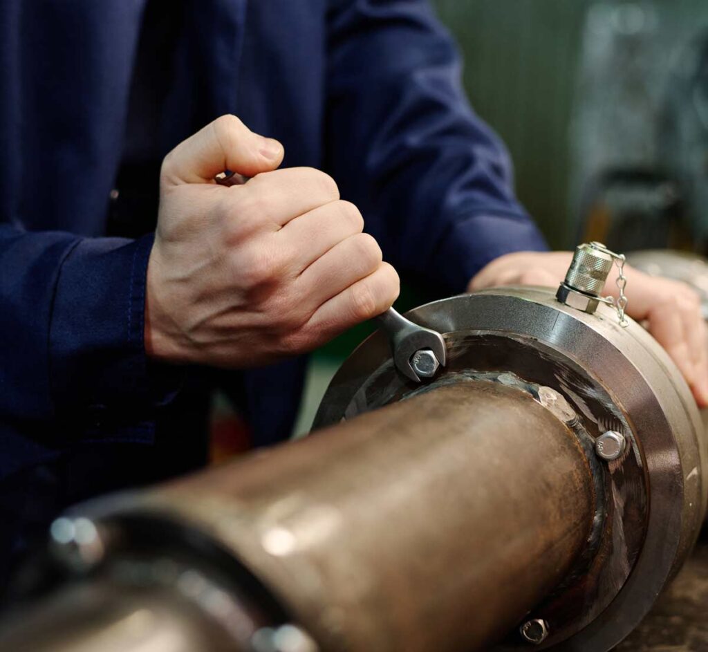 tighetening industiral pipling with industrial gasket inside Coastal Resources Group