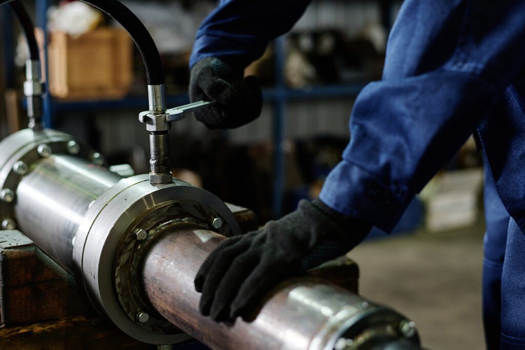unrecognizable worker fixing machine part 2025 02 10 13 19 51 utc Coastal Resources Group